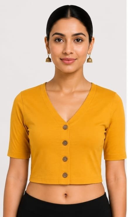 V-Neck — Mustard (front) A close-up of a woman smiling, wearing a mustard V-neck stretchable blouse with decorative buttons and jhumkas.